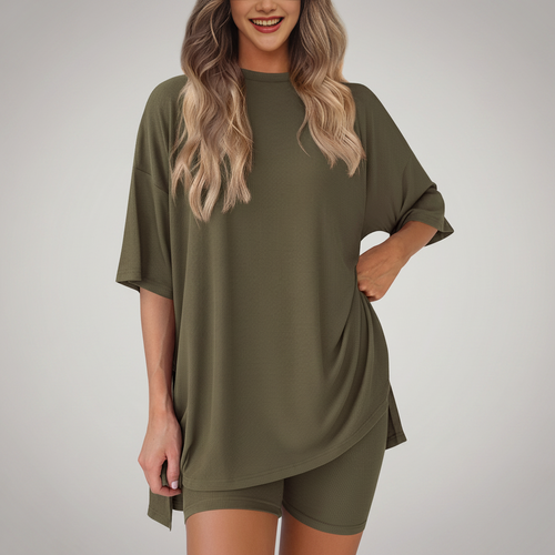 Woman wearing an olive green oversized t-shirt and shorts set on a white background